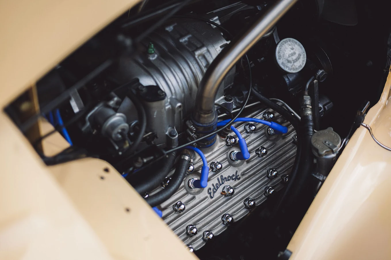 Engine bay with a polished alloy radiator and blue intake manifold